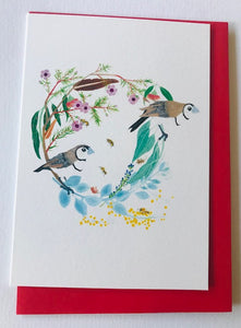 Christmas wreath featuring double barred finches